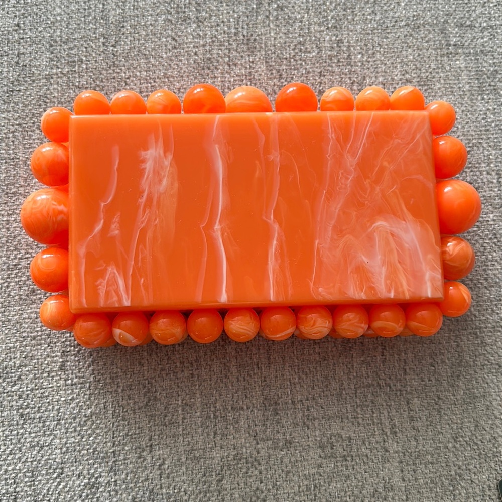Orange clutch with strap